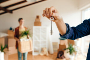 Young couple moving into their new home financed by DMC Finance