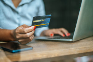 A woman looking at her credit card balance and working out her borrowing capacity